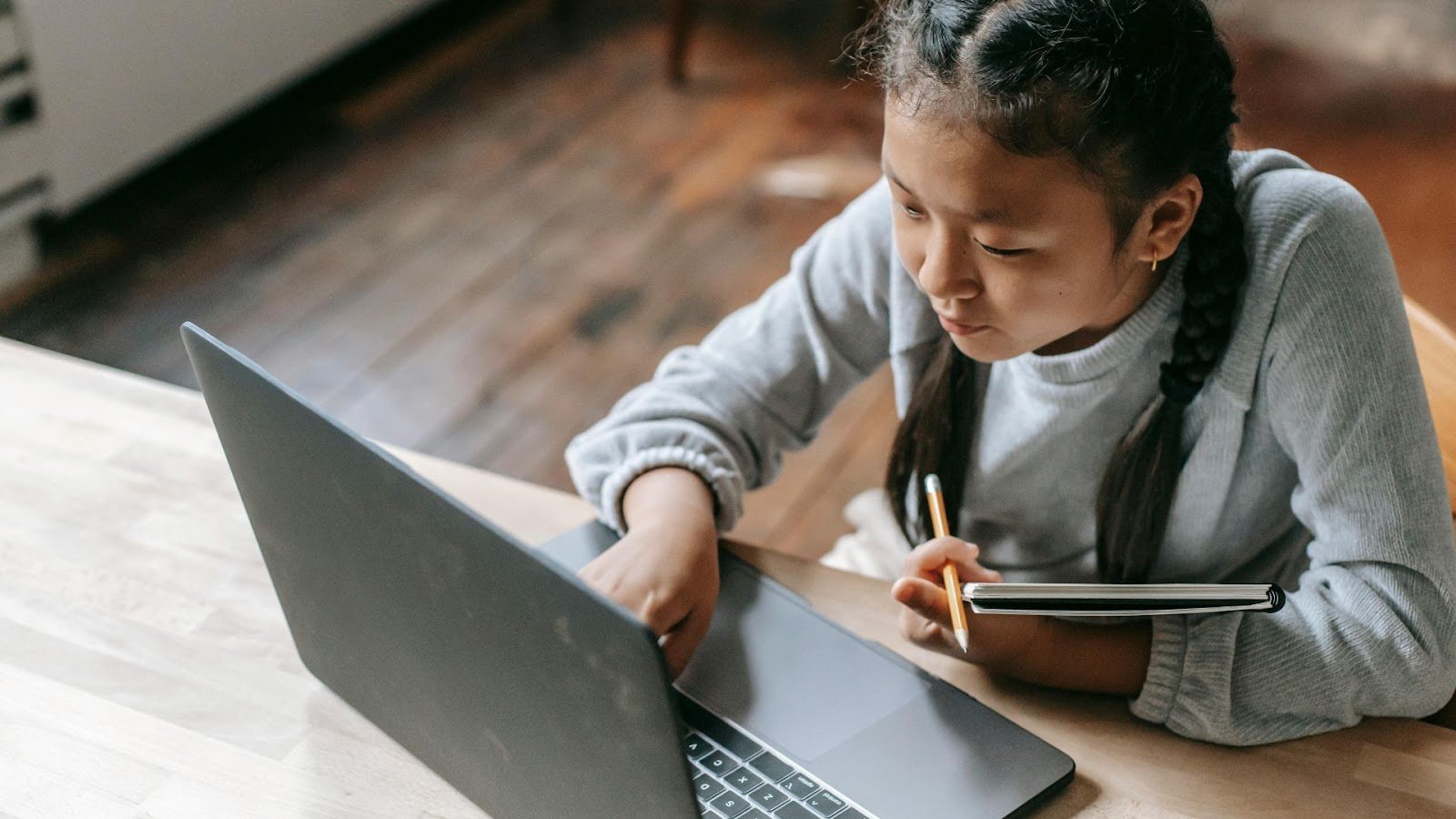 Girl studying something with her laptop
